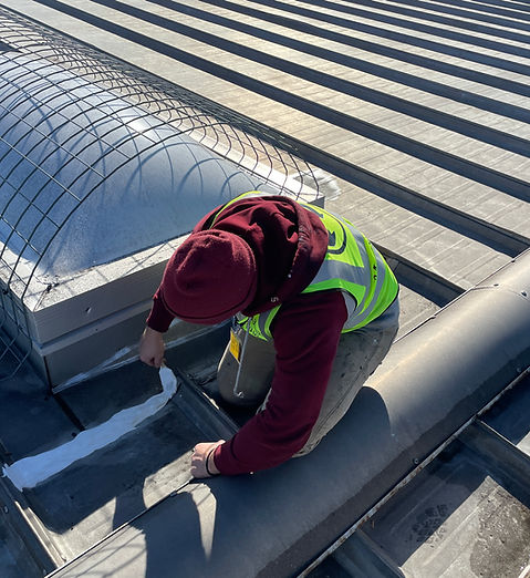 Green Improvements crew working on a commercial roof